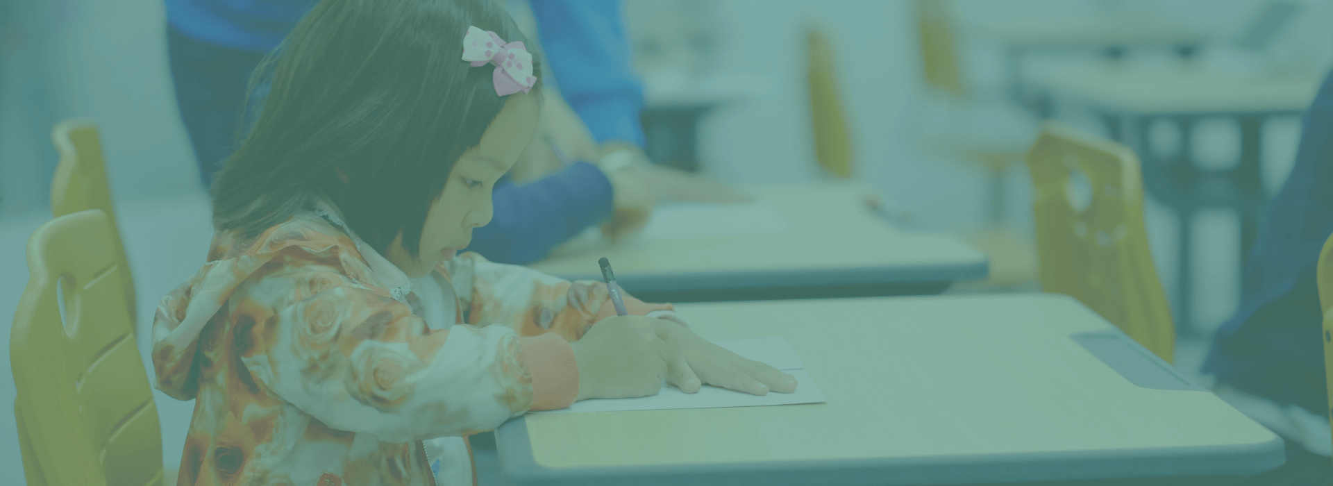 Girl Sitting At Desk